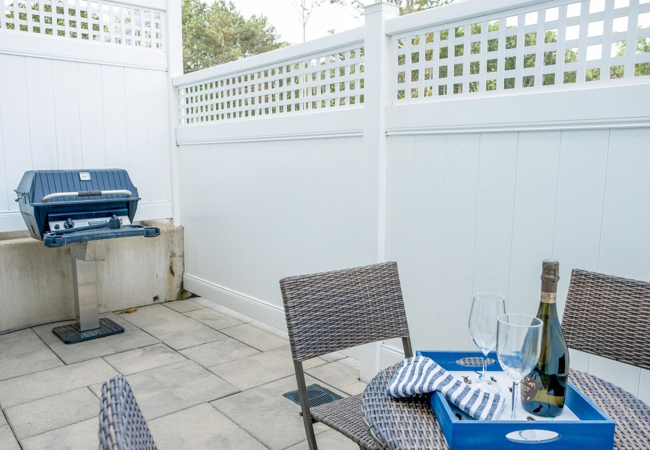 Outside patio with grill and comfortable seating 