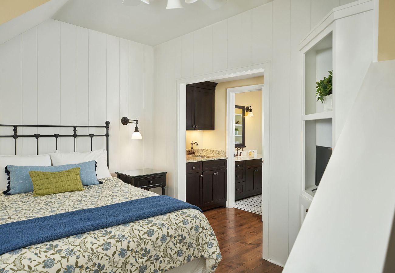 Third floor bedroom with queen bed, full bathroom and walk-in closet