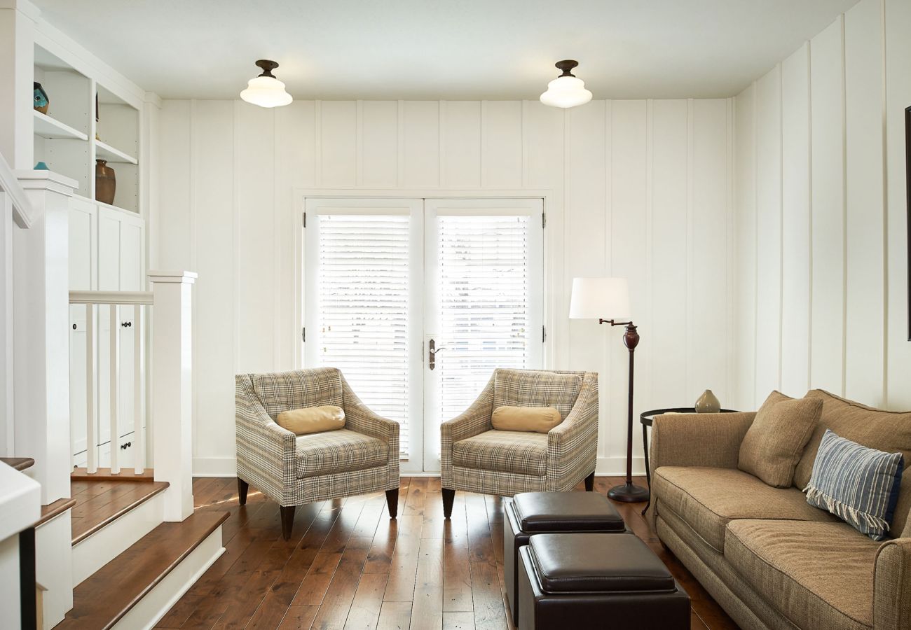 Second floor living room with couch, additional seating and balcony access